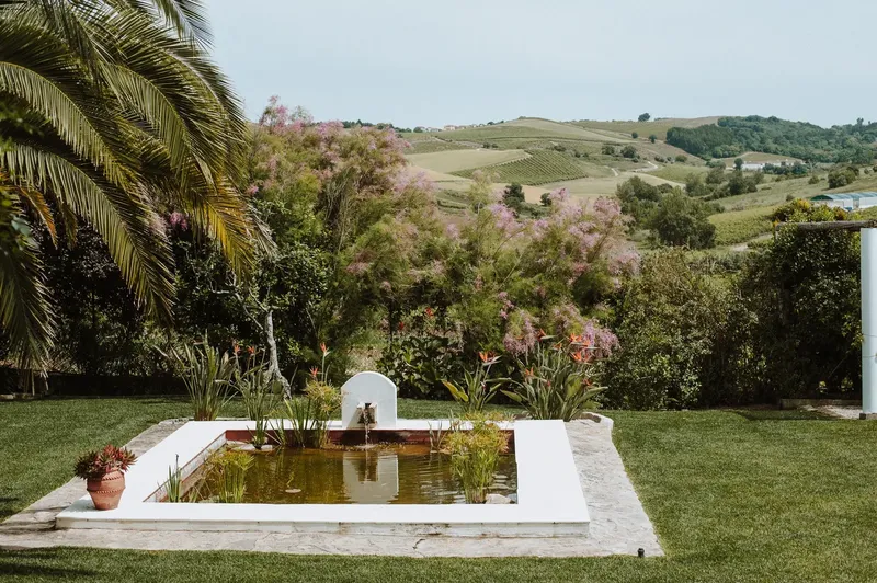 Casa Sacoto exterior · restored 19th-century manor with whitewashed walls and azulejo tile