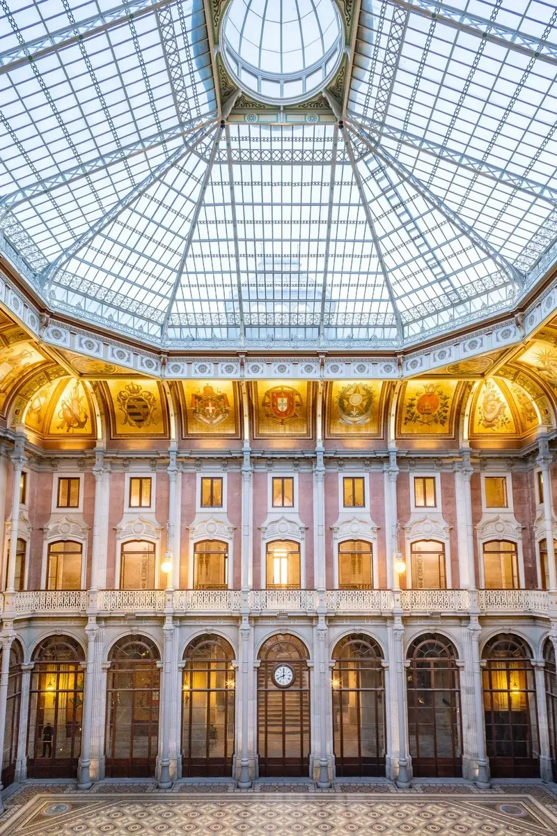 Pátio das Nações at Palácio da Bolsa, showing the octagonal glass-domed central courtyard ringed by 22 national coats of arms