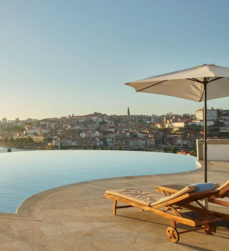 The Yeatman outdoor infinity pool deck with full Porto skyline panorama and the Douro opposite Ribeira, with 250-cocktail capacity as the arrival anchor used by BTQ Events for corporate gala dinners and brand launches